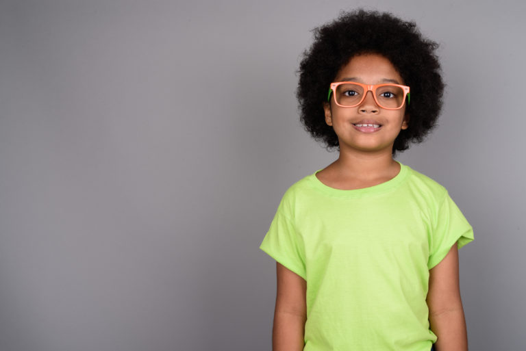 Young child receiving glasses and eye care at Msimbazi Eyes & Vision Care in Dar es Salaam