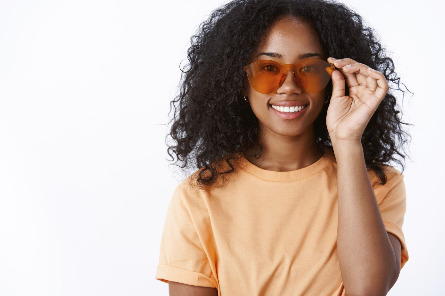 Woman wearing stylish non-designer sunglasses with UV protection in Dar es Salaam, offering trendy eyewear for sun protection and clear vision at Msimbazi Eyes & Vision Care.